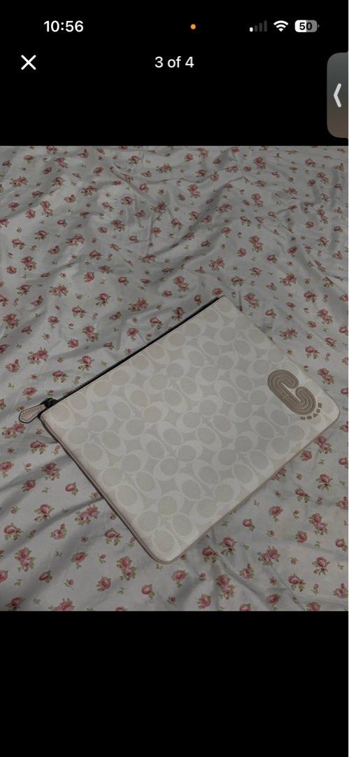 Coach Signature C Monogram Pouch Clutch (Category: Luxury Bags & Wallets) located in La Trinidad. Submitted by caicai1926 (Listing ID 1463662100, Image 2). Description: - Authentic Coach monogram pouch - Color: Cream and beige - Signature 'C' pattern all over - Zipper closure - Interior: Black lining with Coach leather tag - Ideal for organizing essentials or as a small clutch.