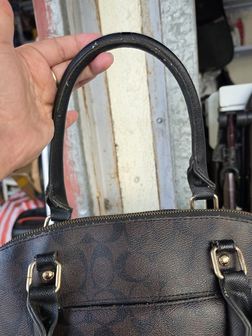 Coach Signature Monogram Dome Satchel Bag (Category: Purses & Pouches) located in Lemery. Submitted by venus23 (Listing ID 1463739645, Image 3). Description: - Coach monogram dome satchel - Classic brown and black colorway - Genuine leather trim and handles - Elegant gold hardware details - Secure zipper closure - Ideal for everyday use - Spacious interior for all your essentials.