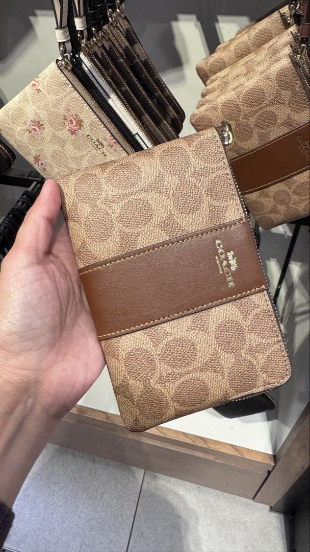 Coach Wristlet Pasabuy from Coach Canada (Category: Wallets & Card holders) located in Anao. Submitted by declutterwithme0520 (Listing ID 1463719794, Image 1). Description: Pasabuy from Coach Canada🇨🇦 ETA Last week of October 2026 50% DP balance upon arrival before shipping Small size 3,200 Large 3,800 - Classic Signature C print available in: - Tan with brown stripe - Black with grey stripe - Beige with floral print - Also available in plain b