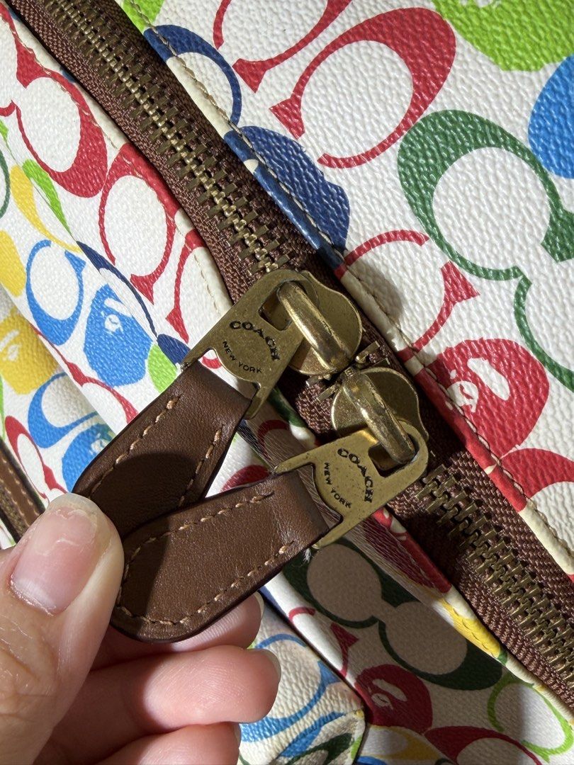 Coach x Bape Multi-Color Monogram Backpack (Category: Backpacks) located in Manila. Submitted by dreyaa22 (Listing ID 1463708759, Image 3). Description: - Authentic Coach x Bape collaboration backpack - Features iconic Coach monogram print - Unique Bape-inspired color palette - Durable brown leather trim and zippers - Adjustable straps for comfortable wear - Ideal for everyday use or as a stylish statement piece.