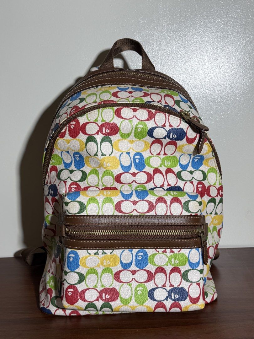 Coach x Bape Multi-Color Monogram Backpack (Category: Backpacks) located in Manila. Submitted by dreyaa22 (Listing ID 1463708759, Image 1). Description: - Authentic Coach x Bape collaboration backpack - Features iconic Coach monogram print - Unique Bape-inspired color palette - Durable brown leather trim and zippers - Adjustable straps for comfortable wear - Ideal for everyday use or as a stylish statement piece.