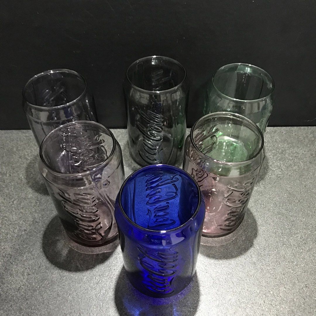 Coca-Cola Can Shaped Glasses Set (Category: Vintage Collectibles) located in Baao. Submitted by all.things.japan (Listing ID 1463583971, Image 3). Description: - Set of 6 Coca-Cola glasses - Unique design shaped like classic soda cans - Includes: 1 blue, 2 pinkish-purple, 1 green, 2 clear glasses - Ideal for collectors or everyday use - Adds a fun and unique touch to your drinkware.