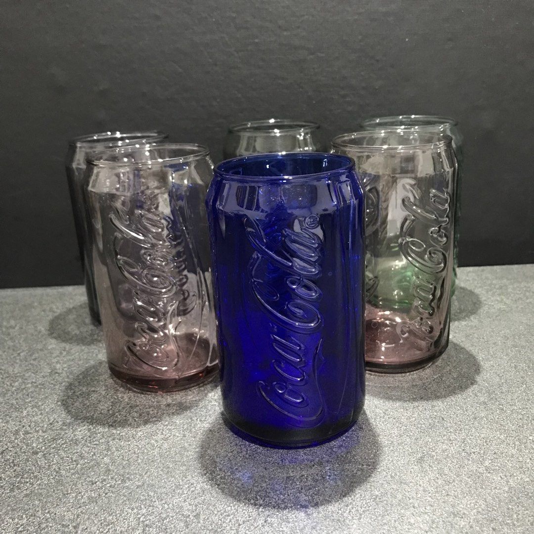Coca-Cola Can Shaped Glasses Set (Category: Vintage Collectibles) located in Baao. Submitted by all.things.japan (Listing ID 1463583971, Image 1). Description: - Set of 6 Coca-Cola glasses - Unique design shaped like classic soda cans - Includes: 1 blue, 2 pinkish-purple, 1 green, 2 clear glasses - Ideal for collectors or everyday use - Adds a fun and unique touch to your drinkware.
