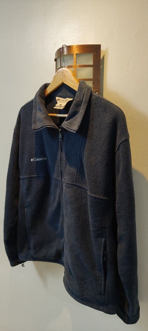 Columbia Fleece Jacket Full Zip Navy Blue (Category: Coats, Jackets and Outerwear) located in Bulacan. Submitted by adrian2325 (Listing ID 1463721010, Image 2). Description: - Classic navy blue Columbia fleece jacket - Full zip front with stand-up collar - Two side pockets, one with zipper closure - Adjustable drawstring hem - Ideal for layering in cooler weather - Comfortable and durable material.