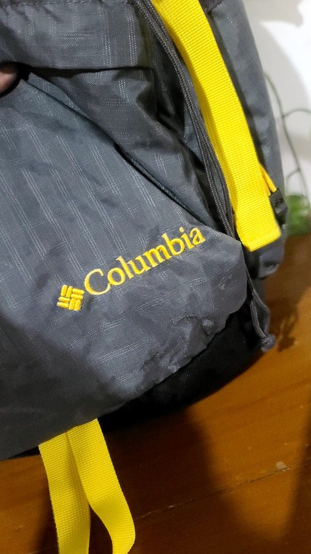 Columbia Grey Backpack with Yellow Accents (Category: Backpacks) located in Baguio. Submitted by phoeberose33384 (Listing ID 1463739668, Image 2). Description: - Grey Columbia backpack with vibrant yellow straps and accents. - Multiple pockets for excellent organization. - Subtle textured pattern on the material. - Adjustable straps for a comfortable, customized fit. - Ideal for day trips, school, or travel..