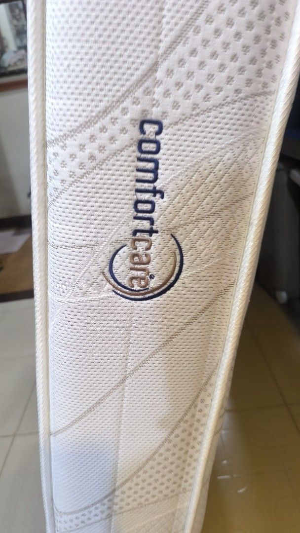 Comfortcare Mattress (Category: Bed Frames & Mattresses) located in Bay. Submitted by alegnaacir (Listing ID 1463640894, Image 2). Description: - Comfortcare mattress, ideal for single beds or children's beds. - Clean white color with a stylish wave pattern. - Features the Comfortcare logo on the side. - Ready for a new home! Please check photos for detailed condition..