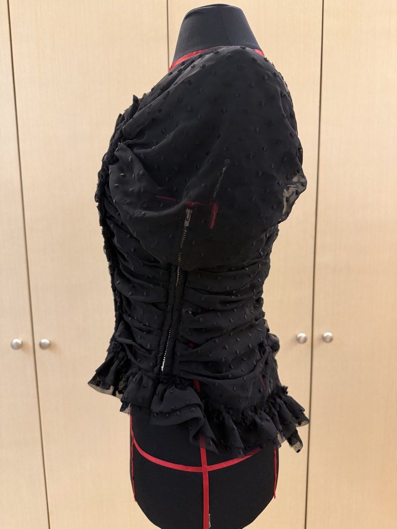 Comme des Garçons Black Ruched Dot Mesh Top Size S (Category: Sleeveless) located in Makati City. Submitted by sellebrity88 (Listing ID 1463639653, Image 2). Description: - Brand: Comme des Garçons - Color: Black - Material: Sheer Mesh - Features: Ruched and braided front detail, ruffled hem, short sleeves - Closure: Side zipper - Size: S - Styling: Ideal for layering or as a statement piece.