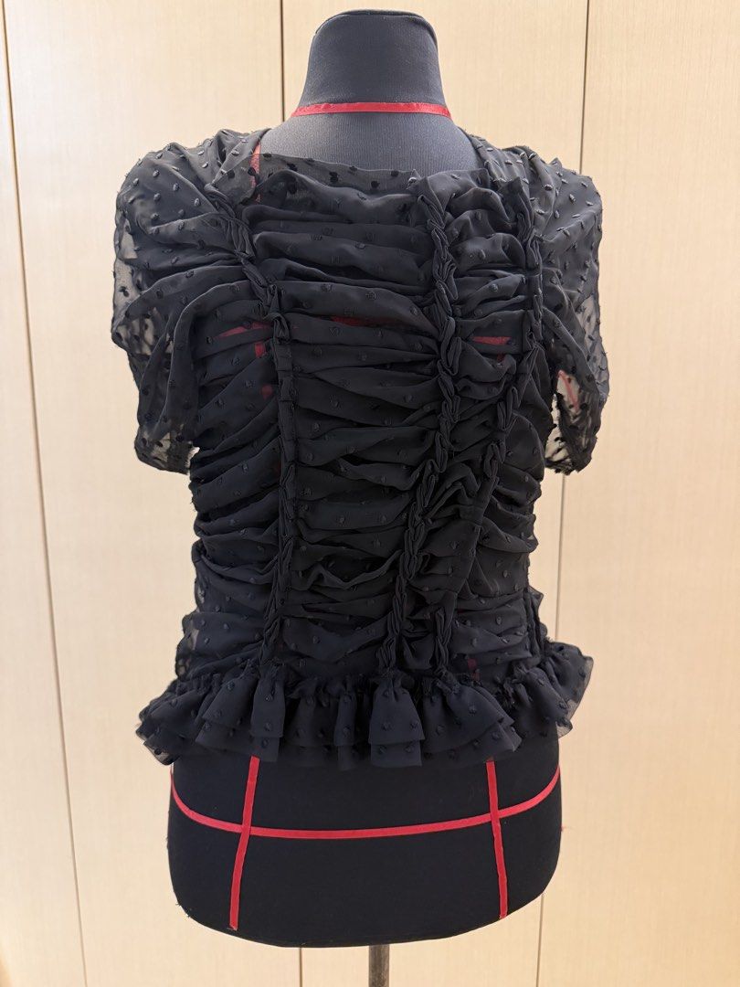 Comme des Garçons Black Ruched Dot Mesh Top Size S (Category: Sleeveless) located in Makati City. Submitted by sellebrity88 (Listing ID 1463639653, Image 1). Description: - Brand: Comme des Garçons - Color: Black - Material: Sheer Mesh - Features: Ruched and braided front detail, ruffled hem, short sleeves - Closure: Side zipper - Size: S - Styling: Ideal for layering or as a statement piece.