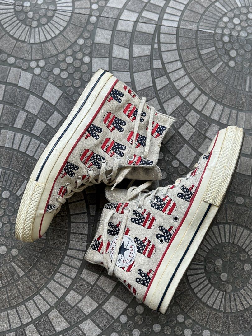 CONVERSE CTAS 70s ELECTION DAY (Category: Sneakers) located in Manila. Submitted by furugi24 (Listing ID 1463589679, Image 2). Description: CONV3RS3 CT@S 70s ELECTION DAY Size: 8.5 8/10 Slight sole sep SRP 1000 Classic Converse high tops - Fun American flag peace sign print - Beige canvas with red and blue accents - Lace-up closure - Perfect statement piece for casual outfits - Shows some signs of wear, but plenty of life left.