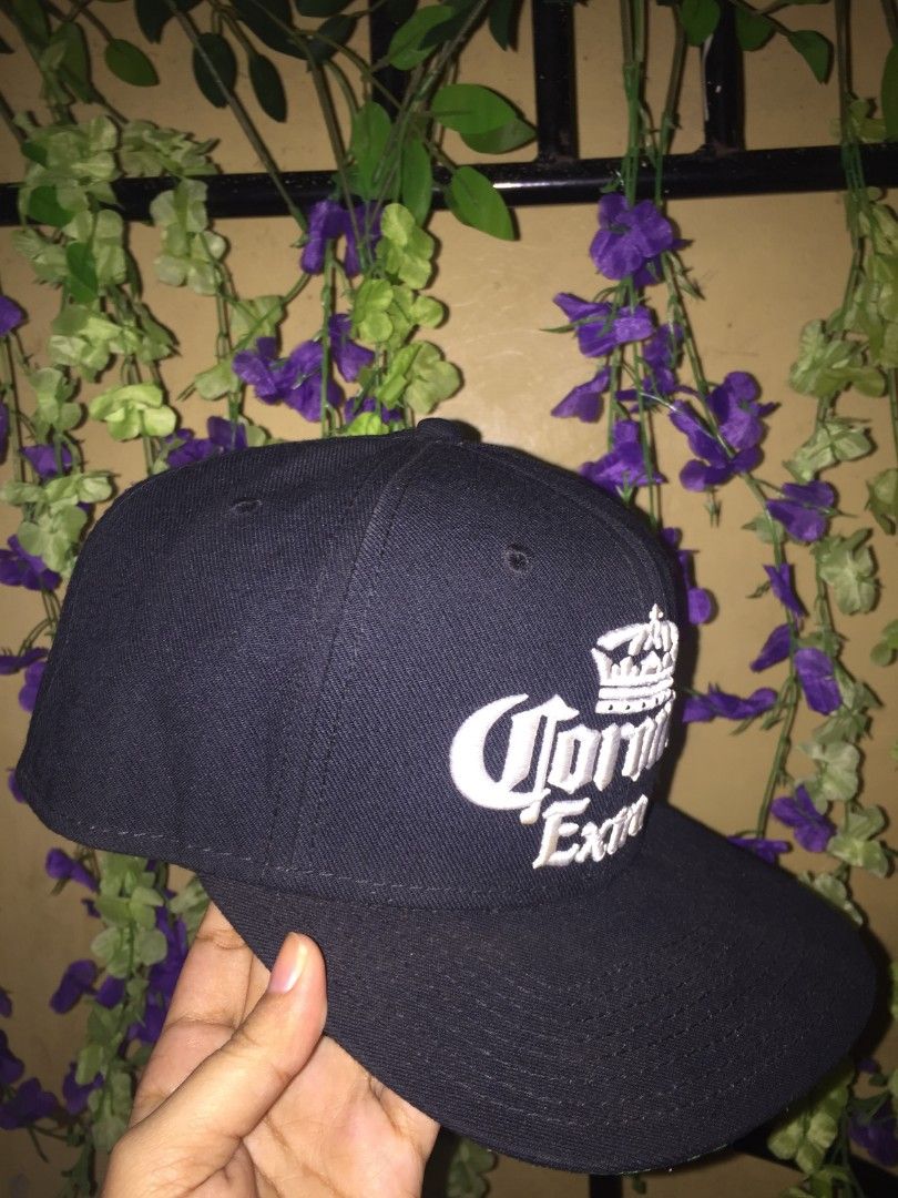 Corona Extra Snapback Cap Find Your Beach (Category: Caps & Hats) located in Manila. Submitted by mr_kim01 (Listing ID 1463610273, Image 2). Description: - Black Corona Extra snapback hat - Features iconic Corona logo on the front - 'Find your beach.' embroidered on the back - Green underside of the brim - One size fits most - Ideal for casual outings or a day at the beach.