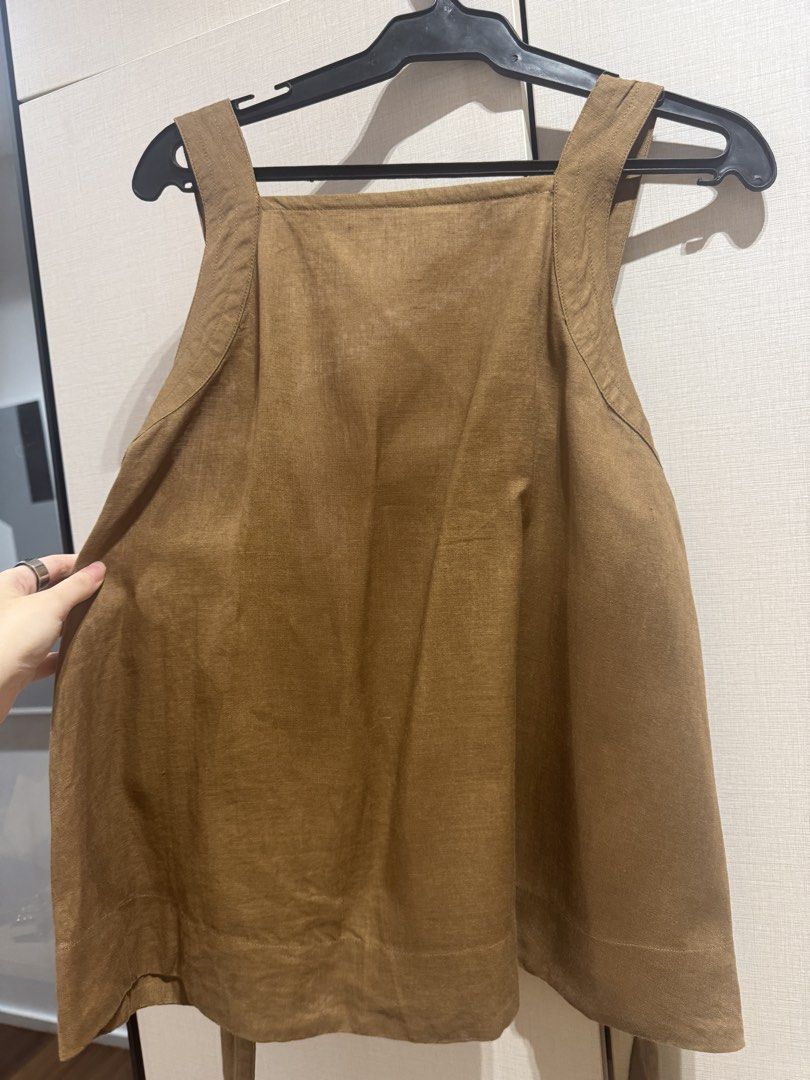 COS Brown Square Neck Sleeveless Top (Category: Sleeveless) located in Quezon City. Submitted by envti (Listing ID 1463702951, Image 2). Description: - Brand: COS - Color: Brown - Style: Sleeveless top - Neckline: Square neck - Fit: Relaxed, slightly flared - Details: Tie details at the back - Material: Linen fabric - Size: EUR 40.