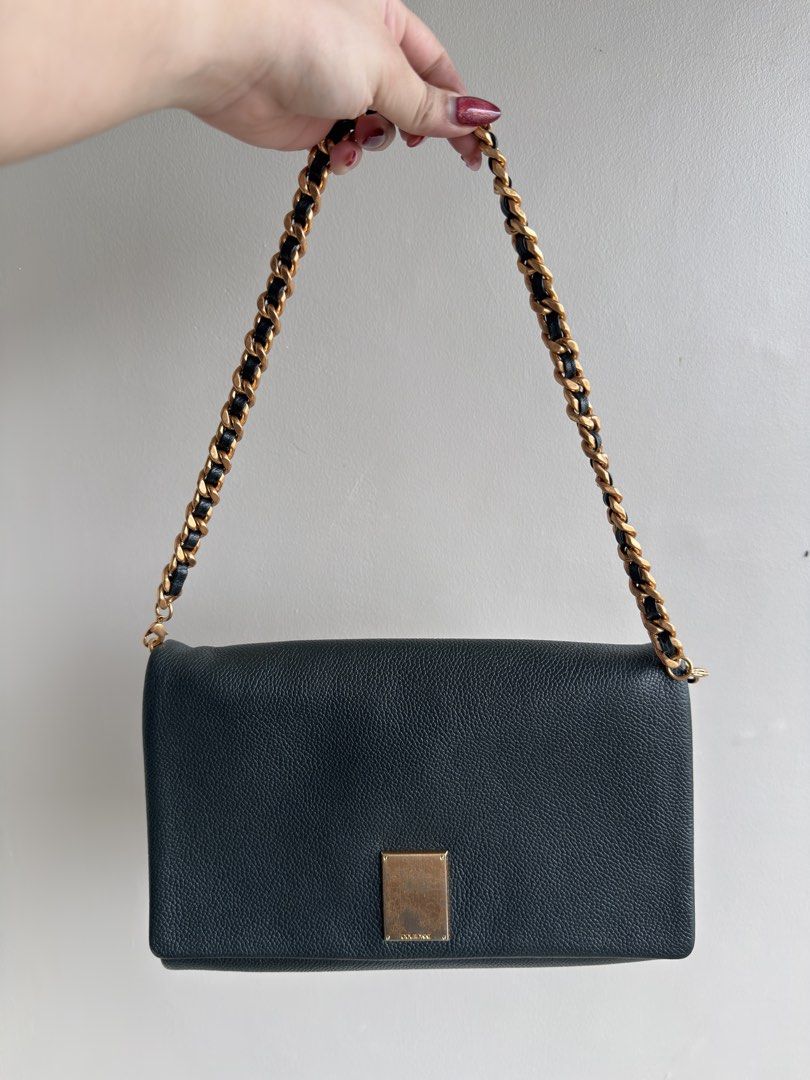 Couronne Dark Green Leather Chain Shoulder Bag (Category: Shoulder Bags) located in Pasay City. Submitted by maviemavz (Listing ID 1463619086, Image 2). Description: ‼️LAST PRICE‼️ Chic dark green leather bag with gold chain. Wear as crossbody or shoulder bag. Includes extra leather strap. Perfect for day or night. .