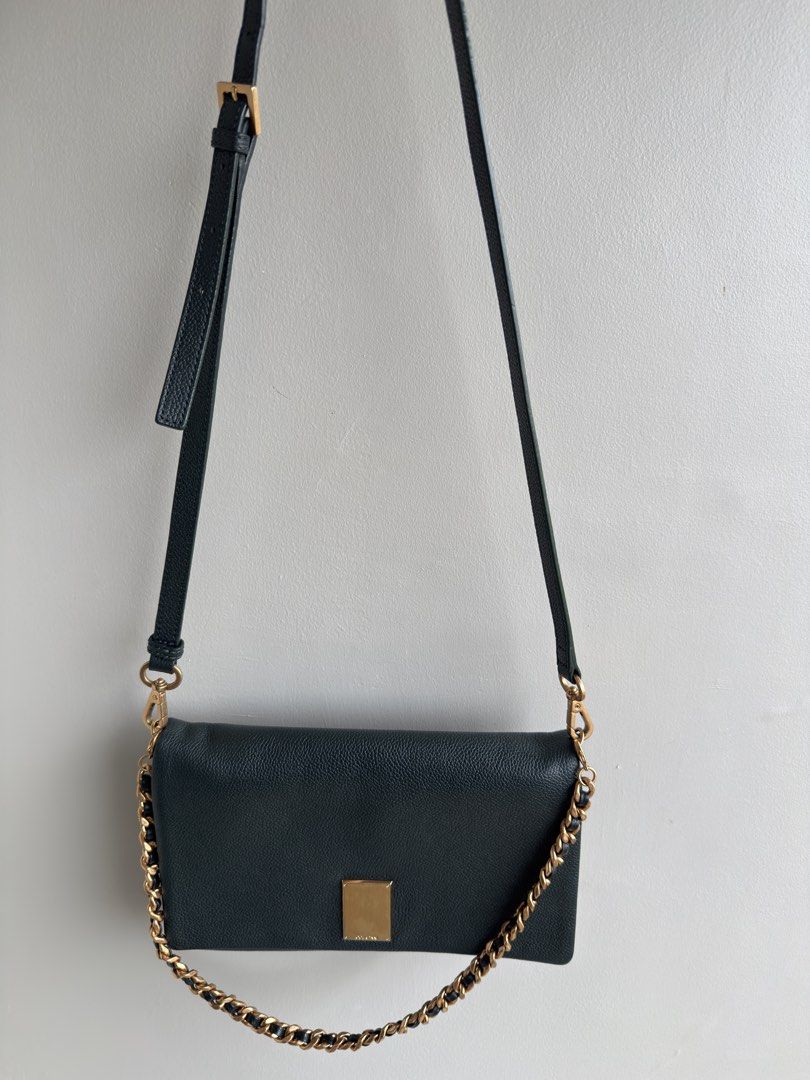 Couronne Dark Green Leather Chain Shoulder Bag (Category: Shoulder Bags) located in Pasay City. Submitted by maviemavz (Listing ID 1463619086, Image 3). Description: ‼️LAST PRICE‼️ Chic dark green leather bag with gold chain. Wear as crossbody or shoulder bag. Includes extra leather strap. Perfect for day or night. .