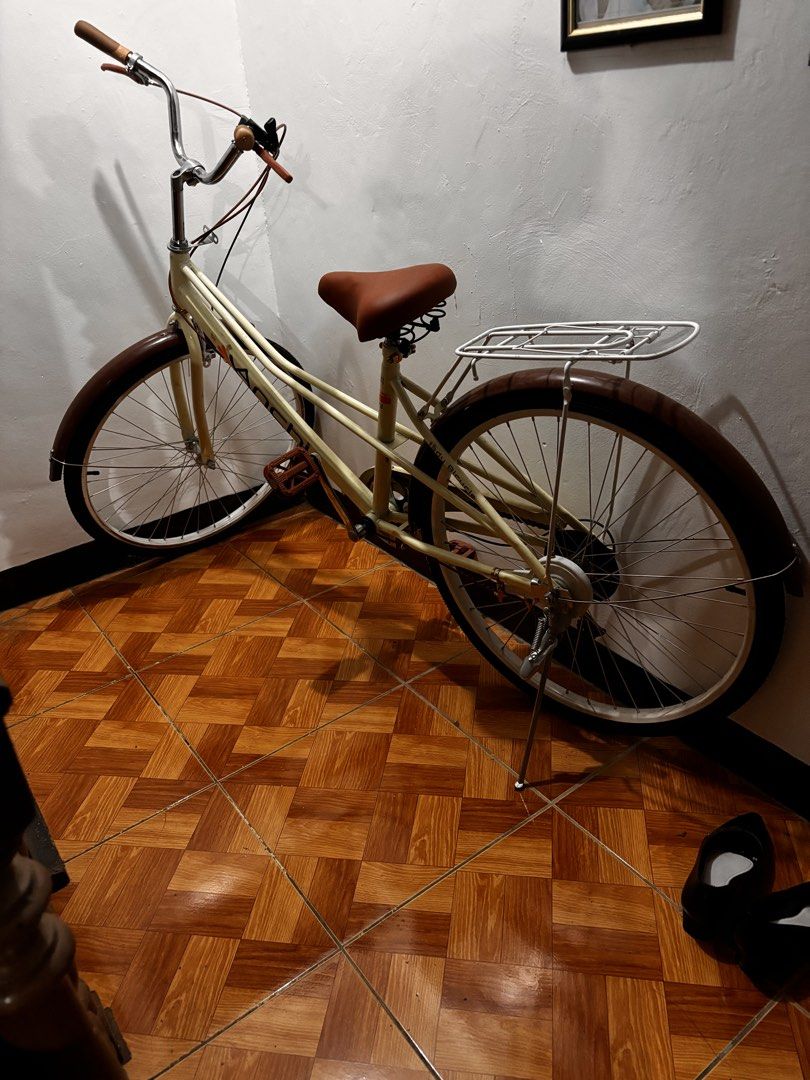 Cream Cruiser Bicycle with Brown Saddle and Rack (Category: Bicycles) located in Manila. Submitted by rmsm. (Listing ID 1463609478, Image 1). Description: - Rfs: Adult Bike no longer needed. Wheels are misaligned. Never been used. Minimal scratches due to delivery. - Cream colored cruiser bike - Comfortable brown saddle - Convenient rear rack for carrying items - Dark brown tires - Ideal for leisurely rides around town - Ready for a new owner.