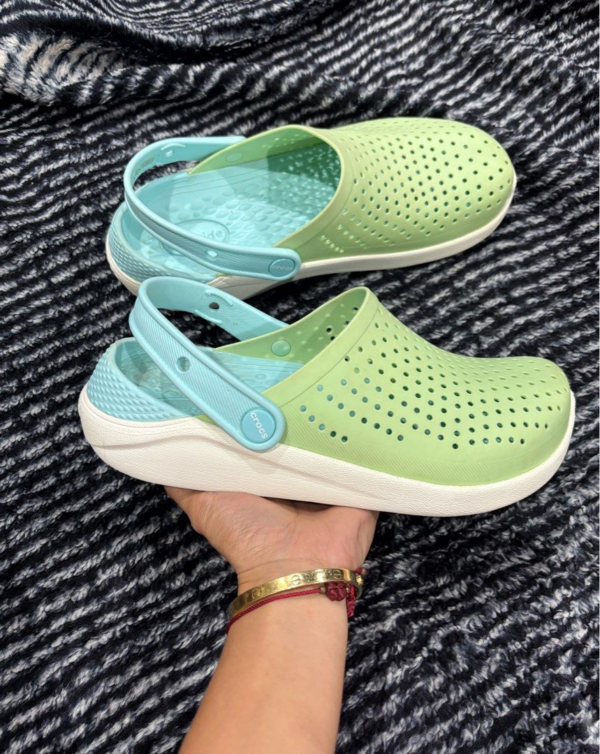 Crocs Literide Clogs Green/Aqua (Category: Slippers & Slides) located in Digos. Submitted by kathydiane76376 (Listing ID 1463693987, Image 1). Description: - Super comfy Crocs Literide Clogs - Color: Light green with aqua blue accents - Easy slip-on design - Ideal for everyday wear, beach trips, or lounging - Features soft and supportive Literide footbed.