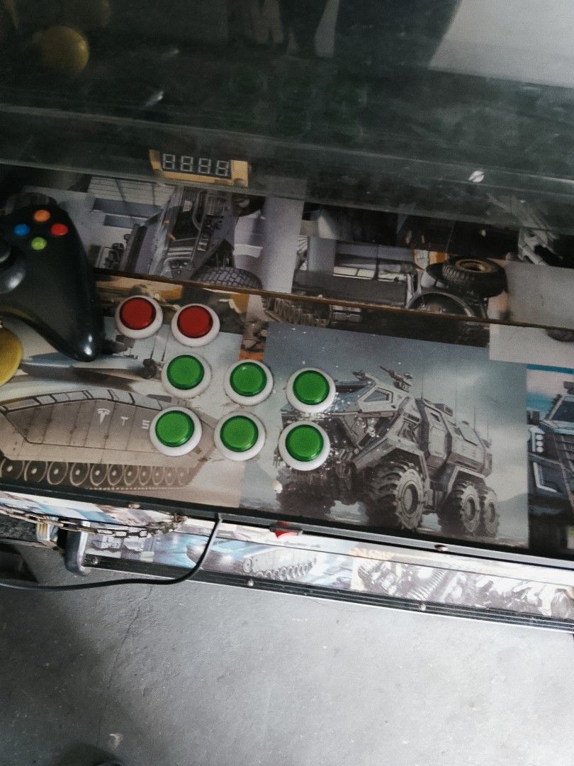 Custom Arcade Machine with Multiple Games (Category: Nintendo) located in Manila. Submitted by juan.hundred04 (Listing ID 1463646836, Image 2). Description: - Full-size arcade machine - Large screen for immersive gameplay - Dual joysticks with multiple buttons - Futuristic, mechanical themed graphics - Includes an Xbox controller for versatile gaming - Ideal for retro gaming enthusiasts - Ready for pickup.