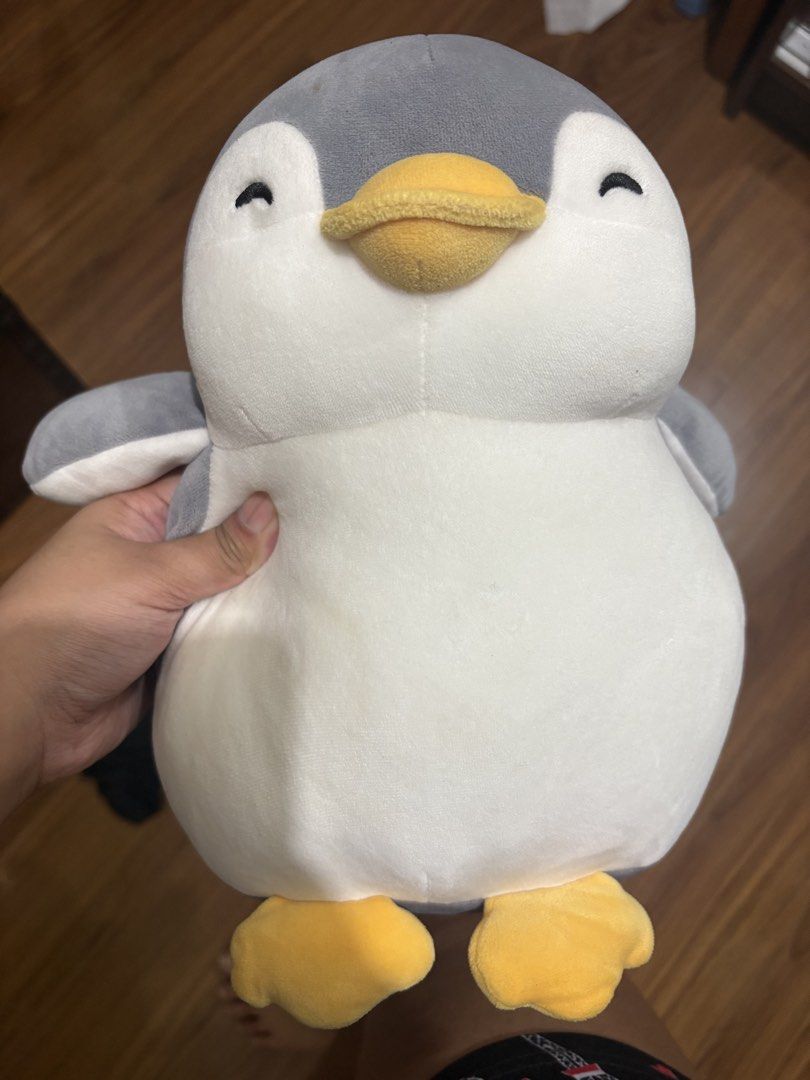 Cute Penguin Plush Toy (Category: Plushies & Soft Toys) located in Quezon City. Submitted by viicx.storm (Listing ID 1463578956, Image 1). Description: - Super soft and cuddly penguin plushie - Features a cute smiling face - Adorable yellow feet - Perfect gift for kids and penguin enthusiasts - Makes a charming desk decoration - Ideal size for hugging.