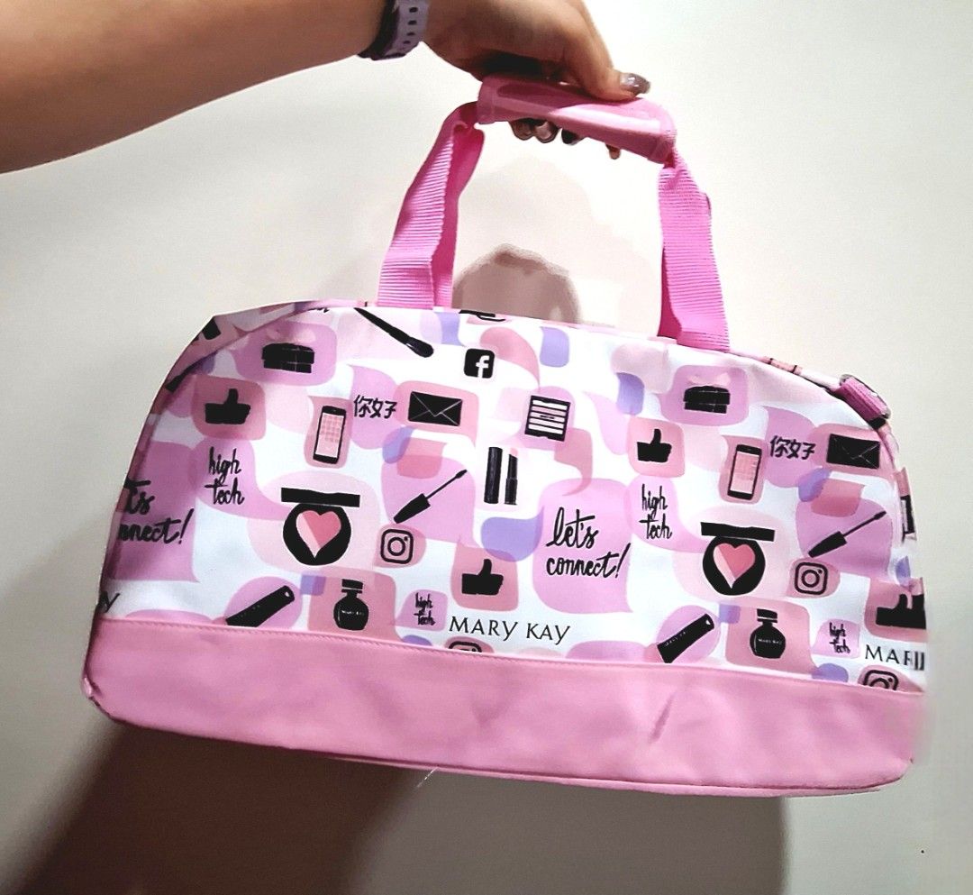 Cute Pink Travel Duffel bag (Category: Purses & Pouches) located in Quezon City. Submitted by tinylittlecorner (Listing ID 1463580228, Image 1). Description: - Adorable Mary Kay cosmetic bag - Features a fun pattern with social media icons, lipstick, and makeup brushes - Stylish pink handles and trim - Ideal for organizing makeup or toiletries - Convenient for travel or everyday use - Easy to carry 2pcs available.
