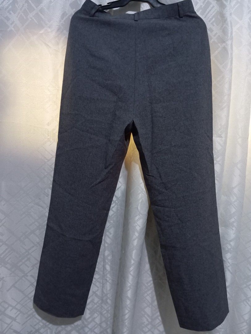 Dark Grey Trousers (Category: Other Bottoms) located in Dasmarinas. Submitted by kei05 (Listing ID 1463568460, Image 2). Description: - Classic dark grey trousers - Button and zip closure at the front - Belt loops for added convenience - Versatile for both work and casual occasions Waistline 25 inches Length 37 inches.