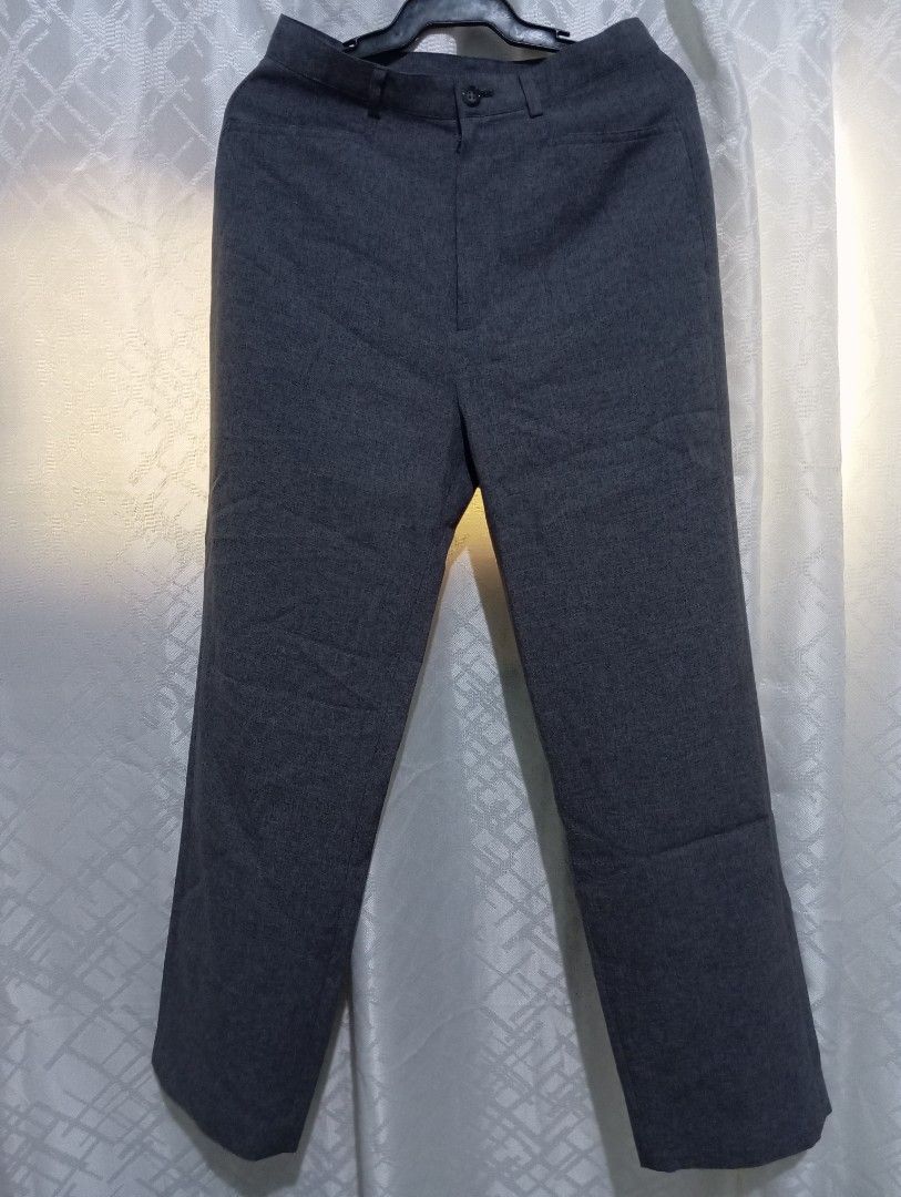 Dark Grey Trousers (Category: Other Bottoms) located in Dasmarinas. Submitted by kei05 (Listing ID 1463568460, Image 1). Description: - Classic dark grey trousers - Button and zip closure at the front - Belt loops for added convenience - Versatile for both work and casual occasions Waistline 25 inches Length 37 inches.