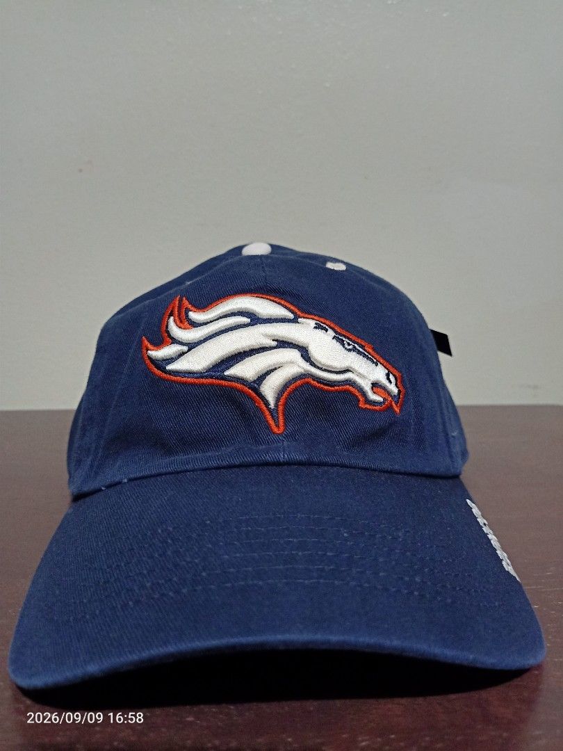 Denver Broncos NFL Team Apparel Cap (Category: Caps & Hats) located in Las Pinas. Submitted by OmengSoyT (Listing ID 1463703153, Image 3). Description: - Authentic Denver Broncos NFL cap - Color Navy Blue - Embroidered Broncos logo on front - 'Broncos' embroidered on the side - 'Broncos Denver' and NFL Team Apparel tag inside - Brandnew - 100 % cotton fabric - Adjustable strap for a comfortable fit (Osfa) - Ideal for any Denver Broncos fan.