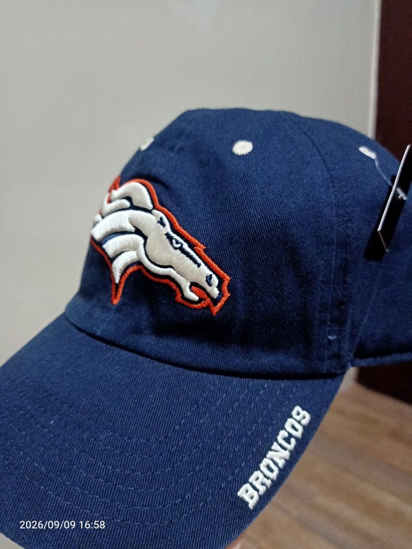 Denver Broncos NFL Team Apparel Cap (Category: Caps & Hats) located in Las Pinas. Submitted by OmengSoyT (Listing ID 1463703153, Image 2). Description: - Authentic Denver Broncos NFL cap - Color Navy Blue - Embroidered Broncos logo on front - 'Broncos' embroidered on the side - 'Broncos Denver' and NFL Team Apparel tag inside - Brandnew - 100 % cotton fabric - Adjustable strap for a comfortable fit (Osfa) - Ideal for any Denver Broncos fan.