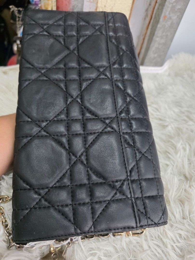 Dior Black Quilted Leather Wallet on Chain (Category: Luxury Bags & Wallets) located in Lemery. Submitted by venus23 (Listing ID 1463739892, Image 3). Description: - Black Dior Wallet on Chain - Quilted Leather with Silver Hardware - Elegant Pearl Detail on Strap - Interior: Card Slots and Zip Pocket - Signs of wear on leather and hardware, adding character - Still a stylish and functional accessory.