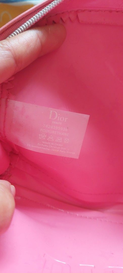 Dior Pink Cosmetic Bag (Category: Luxury Bags & Wallets) located in Baguio. Submitted by lotus_blossom (Listing ID 1463560173, Image 3). Description: - Authentic Dior beauty pouch - Vibrant bright pink color - Made of durable polyurethane - Secure zipper closure - Adorable small Dior charm on zipper pull - Ideal for makeup, cosmetics, or small essentials - Compact size: approximately 7 inches wide and 4 inches tall.
