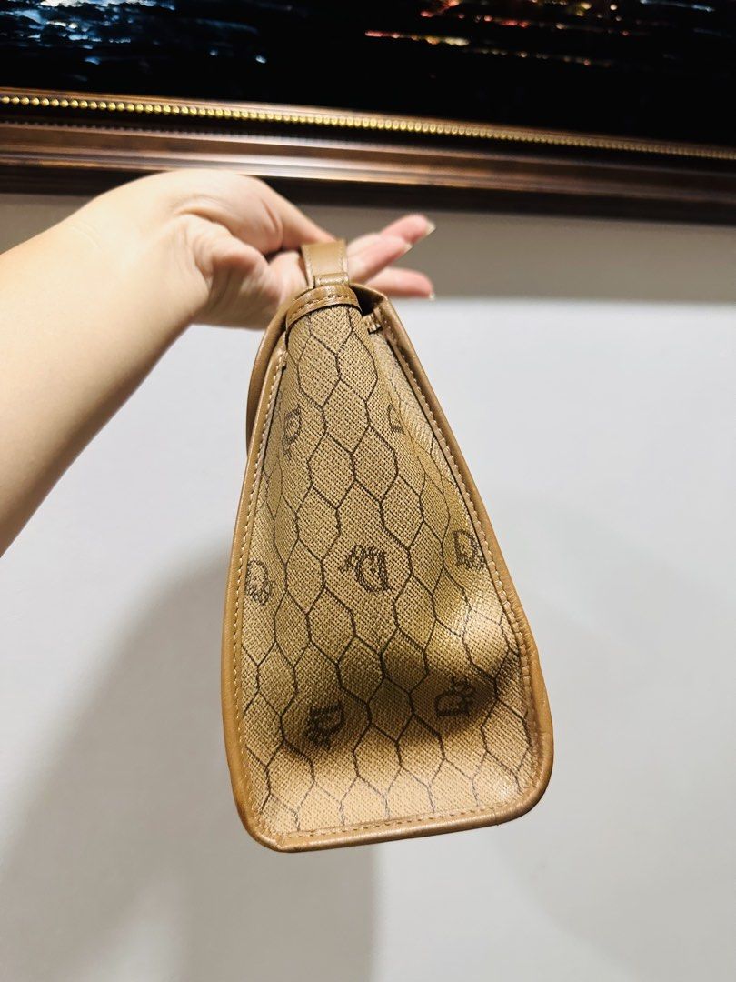 DIOR Top handle bag (Category: Purses & Pouches) located in Batangas. Submitted by stopandshopforluxury (Listing ID 1463736629, Image 3). Description: Guaranteed Original 💯 Flaw inside as seen on the photo. Free organizer can send more photos upon request. What you see is what you get. Shipping via Lalamove, J&T, and LBC Disclaimer: This is a preloved bag. Actual condition is shown in photos. Expect normal signs of wear. Colors may slightly vary