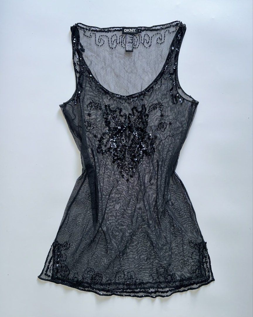 dkny black sheer mesh sequined top (Category: Sleeveless) located in Lipa City. Submitted by mayumi.vtg (Listing ID 1463706524, Image 1). Description: ❀ fits s-m | bust: 32-34in ❀ stretchy fabric, complete sequins, see-through, w/ side slits.