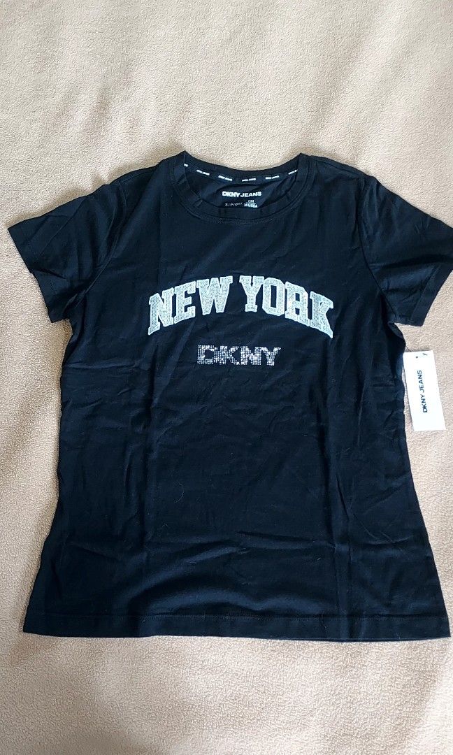 Dkny tshirt womens (Category: Shirts) located in Taguig. Submitted by chariliehi02514 (Listing ID 1463609516, Image 1). Description: brandnew with tag guaranteee original from US size small, can fit semi medium frame runs big onhand and ready to ship MOP - gcash MOD - lalamove, grab or j&t @ buyers expense.