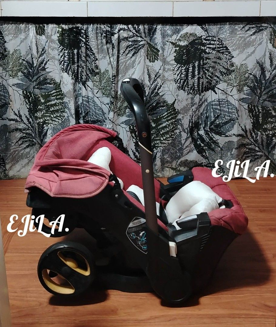 Doona inspired Infant Car Seat and Stroller - Red (Category: Strollers) located in Las Pinas. Submitted by liveflower_ab46a2 (Listing ID 1463571412, Image 1). Description: - Deep red DOONA inspired infant car seat and stroller combo - Effortlessly converts from car seat to stroller - Features a protective sun canopy - Black wheels with yellow accents - Designed for easy maneuverability - Ideal for travel and everyday convenience.