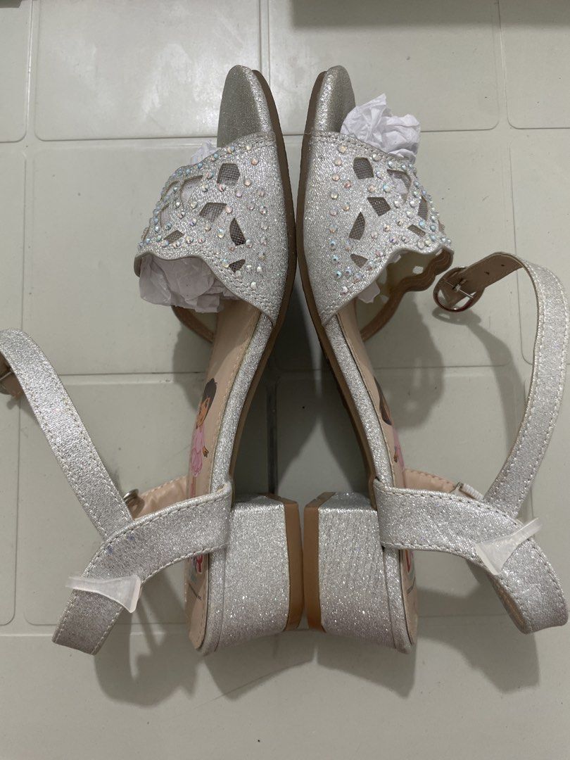 Dora the Explorer Silver Glitter Sparkle Sandals (Category: Babies & Kids Fashion) located in Quezon City. Submitted by sanri23 (Listing ID 1463611123, Image 2). Description: - Sparkly silver sandals featuring Dora the Explorer - Glittery finish with cute cut-out details - Rhinestones on the front strap - Adjustable ankle strap for a secure fit - Chunky block heel design - Perfect for little Dora fans! - Used once only. .