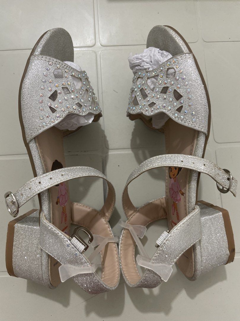 Dora the Explorer Silver Glitter Sparkle Sandals (Category: Babies & Kids Fashion) located in Quezon City. Submitted by sanri23 (Listing ID 1463611123, Image 3). Description: - Sparkly silver sandals featuring Dora the Explorer - Glittery finish with cute cut-out details - Rhinestones on the front strap - Adjustable ankle strap for a secure fit - Chunky block heel design - Perfect for little Dora fans! - Used once only. .