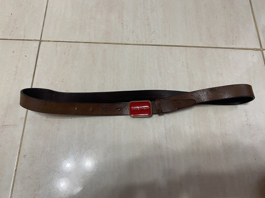 DSQUARED2 Red Buckle Leather Belt (Category: Belts) located in Alburquerque. Submitted by zanegavynn43872 (Listing ID 1463739519, Image 1). Description: - Brown leather belt - Bold red DSQUARED2 buckle with gold-tone trim - Rectangular buckle with glossy red enamel finish - A statement piece to elevate any outfit 30to 38 fit.