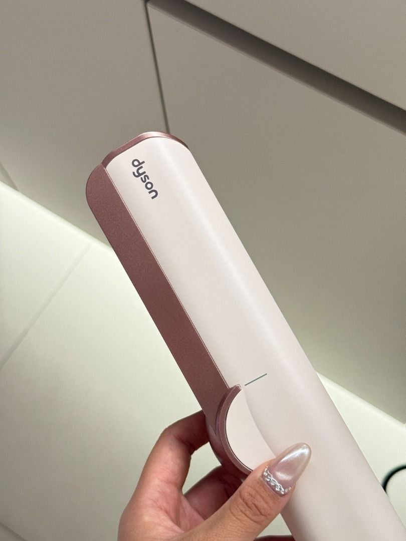 Dyson Corrale Straightener - Rose Gold (Category: Hair) located in Makati City. Submitted by keenstar-c35f66 (Listing ID 1463652103, Image 3). Description: - Dyson Corrale Straightener - Color: Rose Gold - Excellent condition, used only a few times - Suitable for both straightening and curling - Includes charging cord and stand.