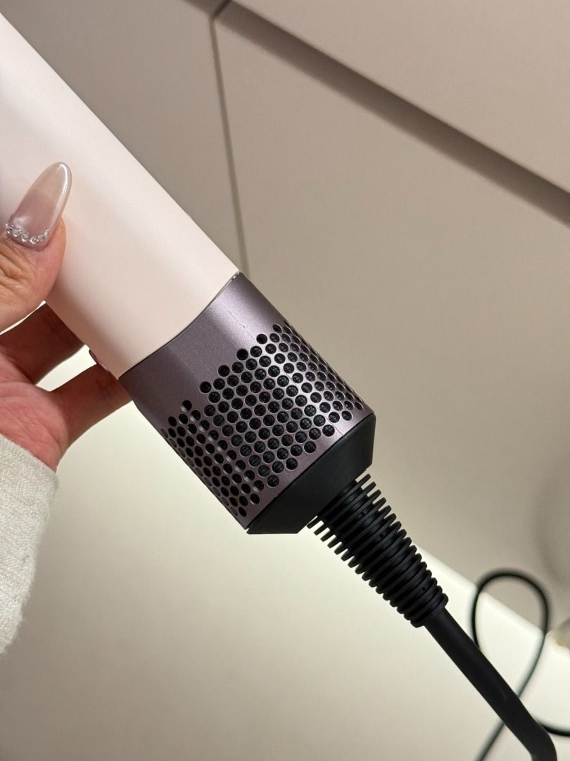 Dyson Corrale Straightener - Rose Gold (Category: Hair) located in Makati City. Submitted by keenstar-c35f66 (Listing ID 1463652103, Image 2). Description: - Dyson Corrale Straightener - Color: Rose Gold - Excellent condition, used only a few times - Suitable for both straightening and curling - Includes charging cord and stand.