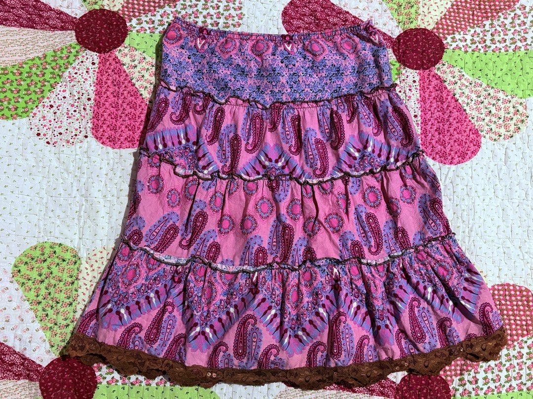 Emergency Exit Pink Paisley Tiered Mini Skirt (Category: Skirts) located in San Mateo. Submitted by _kristineee_ (Listing ID 1463716425, Image 1). Description: - Cute pink tiered mini skirt - Features a fun paisley print - Ruffled hem with delicate lace trim - Comfortable elastic waistband - Versatile for casual outings or dressing up - Flirty and fun design.