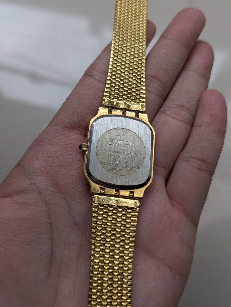 Enicar Quartz Gold Tone Swiss Made (Category: Women's Watches) located in Quezon City. Submitted by dustydialsph (Listing ID 1463661064, Image 2). Description: - Elegant gold tone Enicar watch - Rectangular face with a sophisticated ribbed dial - Reliable quartz movement - Includes a matching gold tone mesh bracelet - Timeless, classic design suitable for daily wear or special events.
