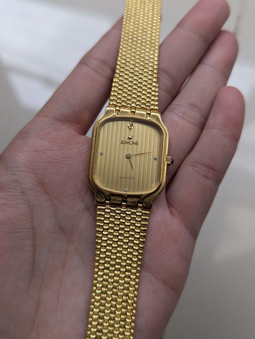 Enicar Quartz Gold Tone Swiss Made (Category: Women's Watches) located in Quezon City. Submitted by dustydialsph (Listing ID 1463661064, Image 1). Description: - Elegant gold tone Enicar watch - Rectangular face with a sophisticated ribbed dial - Reliable quartz movement - Includes a matching gold tone mesh bracelet - Timeless, classic design suitable for daily wear or special events.