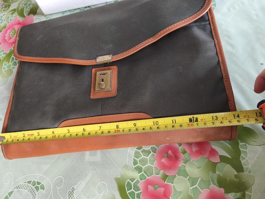 Envelope pouch (Category: Belt bags, Clutches and Pouches) located in San Juan City. Submitted by vingabby (Listing ID 1463578523, Image 3). Description: - envelope clutch nylon material - Secure gold-tone lock closure on the front - Convenient zippered pocket on the back - 'Angel' brand name embossed on leather trim .