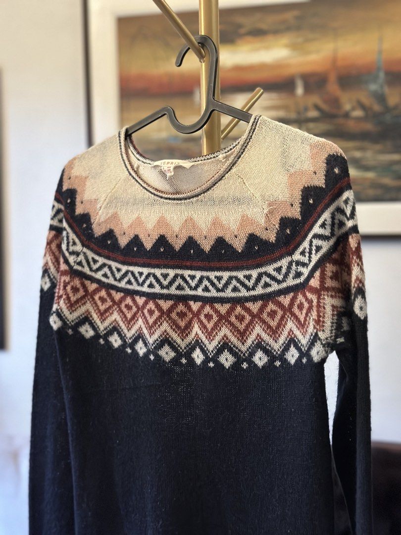 Esprit Fair Isle Knit Sweater (Category: Longsleeves) located in Manila. Submitted by timelessfindsbyjoann (Listing ID 1463710681, Image 2). Description: - Esprit sweater with classic Fair Isle pattern - Navy base with geometric designs in cream, rust, and pink - Long sleeves and crew neck - Comfortable knit fabric - Ideal for layering or wearing on its own - Pairs well with jeans or casual pants.