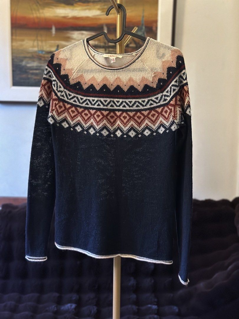 Esprit Fair Isle Knit Sweater (Category: Longsleeves) located in Manila. Submitted by timelessfindsbyjoann (Listing ID 1463710681, Image 1). Description: - Esprit sweater with classic Fair Isle pattern - Navy base with geometric designs in cream, rust, and pink - Long sleeves and crew neck - Comfortable knit fabric - Ideal for layering or wearing on its own - Pairs well with jeans or casual pants.