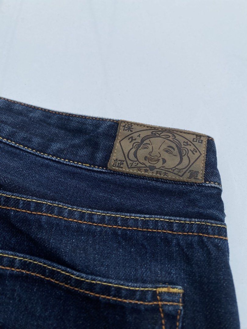 EVISU Jeans 100/72A Size 27 (Category: Luxury Apparel) located in Cagayan de Oro. Submitted by martinduarte22 (Listing ID 1463607361, Image 1). Description: - Authentic Evisu Jeans - Dark Wash Denim - Iconic Seagull Logo on Back Pocket - Button Fly Closure - Red Tab Selvedge Denim - Made in Japan Dimensions: 32 Waistline 38 Length 12 Thigh 7 Hem - Size: 27 on tag (but fit 32 waistline) -Issue: Hairline cracks .