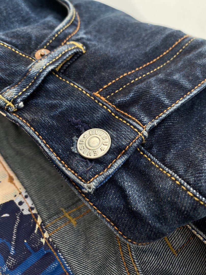 EVISU Jeans 100/72A Size 27 (Category: Luxury Apparel) located in Cagayan de Oro. Submitted by martinduarte22 (Listing ID 1463607361, Image 2). Description: - Authentic Evisu Jeans - Dark Wash Denim - Iconic Seagull Logo on Back Pocket - Button Fly Closure - Red Tab Selvedge Denim - Made in Japan Dimensions: 32 Waistline 38 Length 12 Thigh 7 Hem - Size: 27 on tag (but fit 32 waistline) -Issue: Hairline cracks .