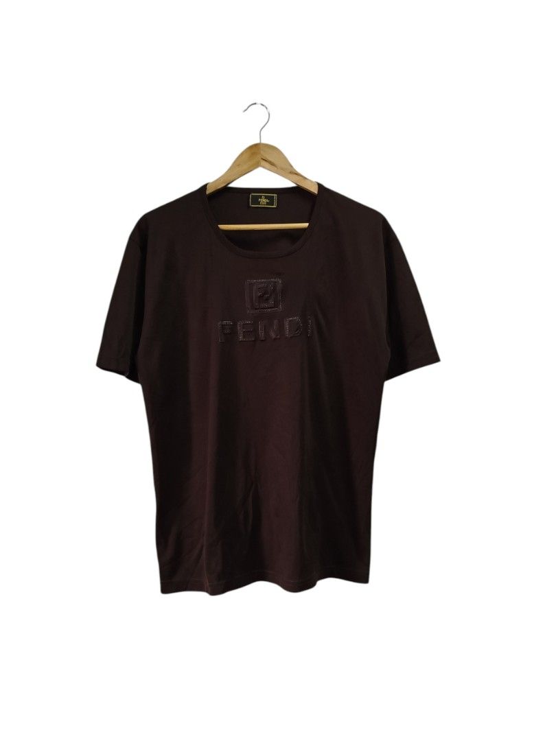 FENDI SHORT SLEEVE BROWN SHIRT (Category: Tshirts & Polo Shirts ) located in Bayombong. Submitted by Gentlemans_ClosEt (Listing ID 1463650400, Image 1). Description: VINTAGE FENDI SHORT SLEEVE BROWN SHIRT (💯% guaranteed authentic) SIZE MEDIUM DIMES: W21 X L27 EXCELLENT CONDITION SEMI FADE PRINT ON THE EMBOSSED LOGO.