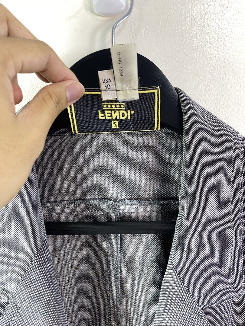 Fendi Short Sleeve Button Up Blouse (Category: Blouses) located in Manila. Submitted by declutterpromax (Listing ID 1463638516, Image 3). Description: - Fendi short sleeve blouse - Made in Italy - Two chest pockets - Button closure - Size: 44 (US 10) - Perfect wardrobe staple.