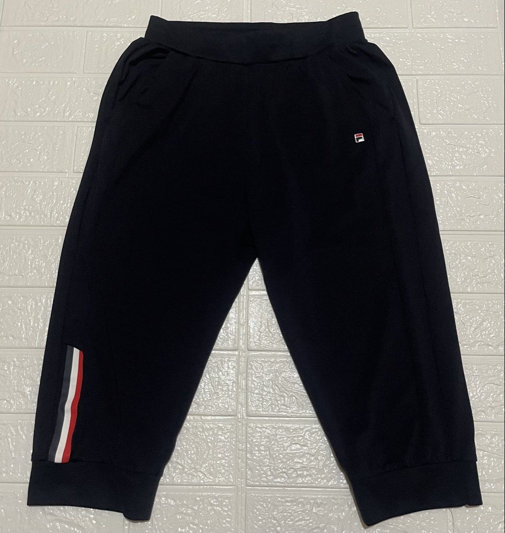 FILA RED Capri Jogger Pants Cropped (Category: Activewear) located in Marilao. Submitted by clear_out_closet (Listing ID 1463561959, Image 1). Description: Item Details: 👇 • Brand: FILA (RED Line) • Color: Dark Navy Blue / Black • Material: 91% Nylon, 9% Spandex - Smooth Technical Stretch Knit • Sizing: Tagged 165/68A (165) / Fits Women’s XS to Slim Small (Refer to flat measurements) • Style / Tag Codes: K62G023601 / NS01 • Additional Label Deta