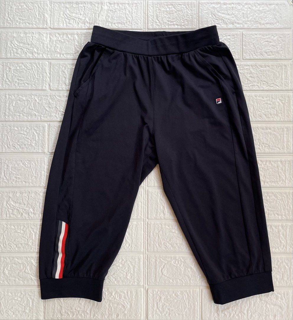 FILA RED Capri Jogger Pants Cropped (Category: Activewear) located in Marilao. Submitted by clear_out_closet (Listing ID 1463561959, Image 3). Description: Item Details: 👇 • Brand: FILA (RED Line) • Color: Dark Navy Blue / Black • Material: 91% Nylon, 9% Spandex - Smooth Technical Stretch Knit • Sizing: Tagged 165/68A (165) / Fits Women’s XS to Slim Small (Refer to flat measurements) • Style / Tag Codes: K62G023601 / NS01 • Additional Label Deta