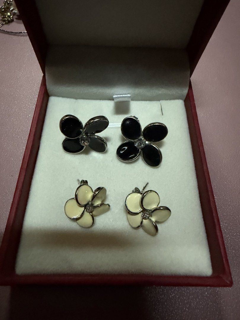 Flower Stud Earrings - Black and Cream Set (Category: Earrings) located in Pasig City. Submitted by aprilluxcloset0812 (Listing ID 1463737812, Image 1). Description: - Set of 4 flower stud earrings - Two pairs are black with a clear gem center - Two pairs are cream colored with a gem center - Versatile for everyday wear or to elevate your look Fashion Accessories ONLY, NO BOX (Box is for photo ops purpose only) Small ziplock included once shipped